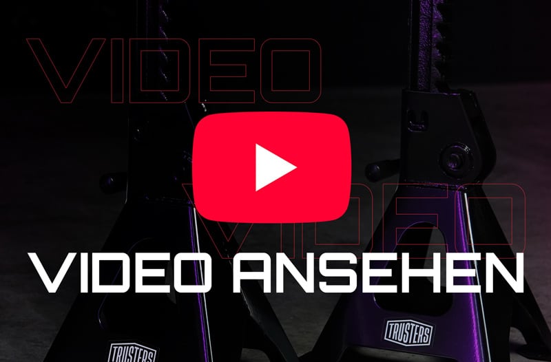 Rotes YouTube-Play-Symbol über weißem Text VIDEO ANSEHEN vor dunklem Hintergrund mit zwei violett beleuchteten Unterstellböcken und sichtbarem TRUSTERS-Logo