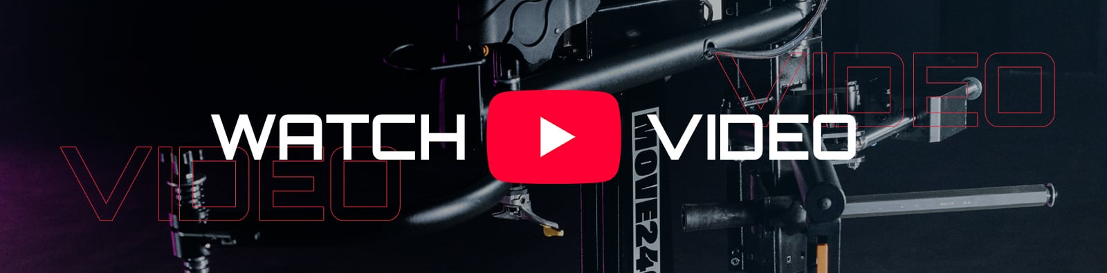 Dark wide banner showing a close-up camera rig and cables, a large red YouTube play button icon centered, bold white text WATCH VIDEO overlaid, and repeated outlined VIDEO text in red on both sides