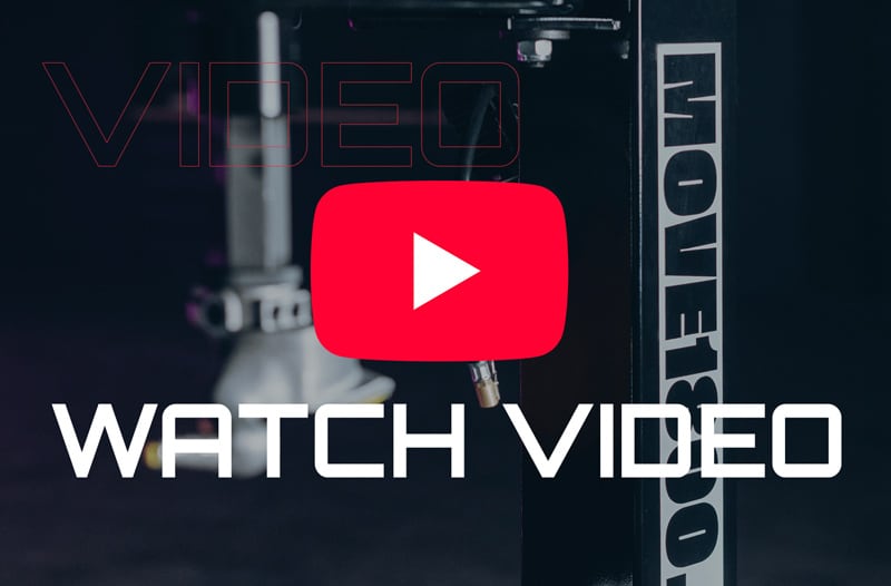 Red YouTube play button icon centered over blurred studio microphone and equipment background with bold white text WATCH VIDEO