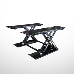 Black scissor-style hydraulic lift with two diamond-plate platforms and crossed support arms for motorcycles or small vehicles, shown on a white background
