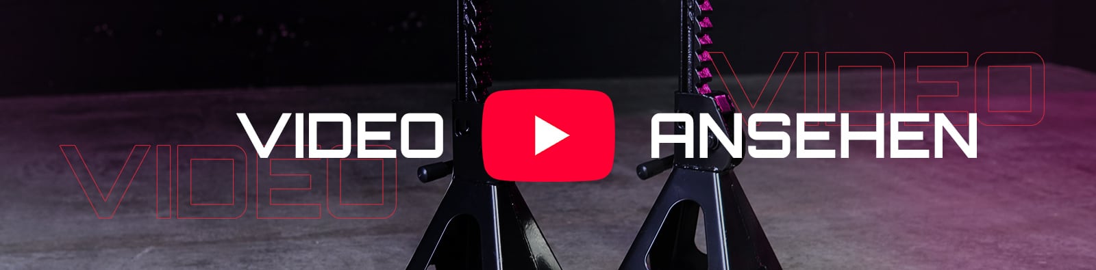 Zwei schwarze Wagenheber-Ständer auf Betonboden, rotes YouTube-Play-Symbol mittig, weißer Schriftzug VIDEO ANSEHEN und roter Umrissschriftzug VIDEO im Hintergrund