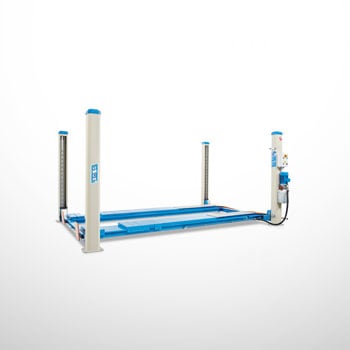 Blue four-post car lift with low-profile drive-on platform and hydraulic power unit mounted at one corner on a white background