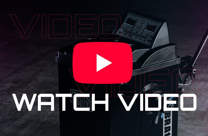 Red YouTube play icon centered over a dark wheeled equipment case with control panel and large white text WATCH VIDEO across the lower area