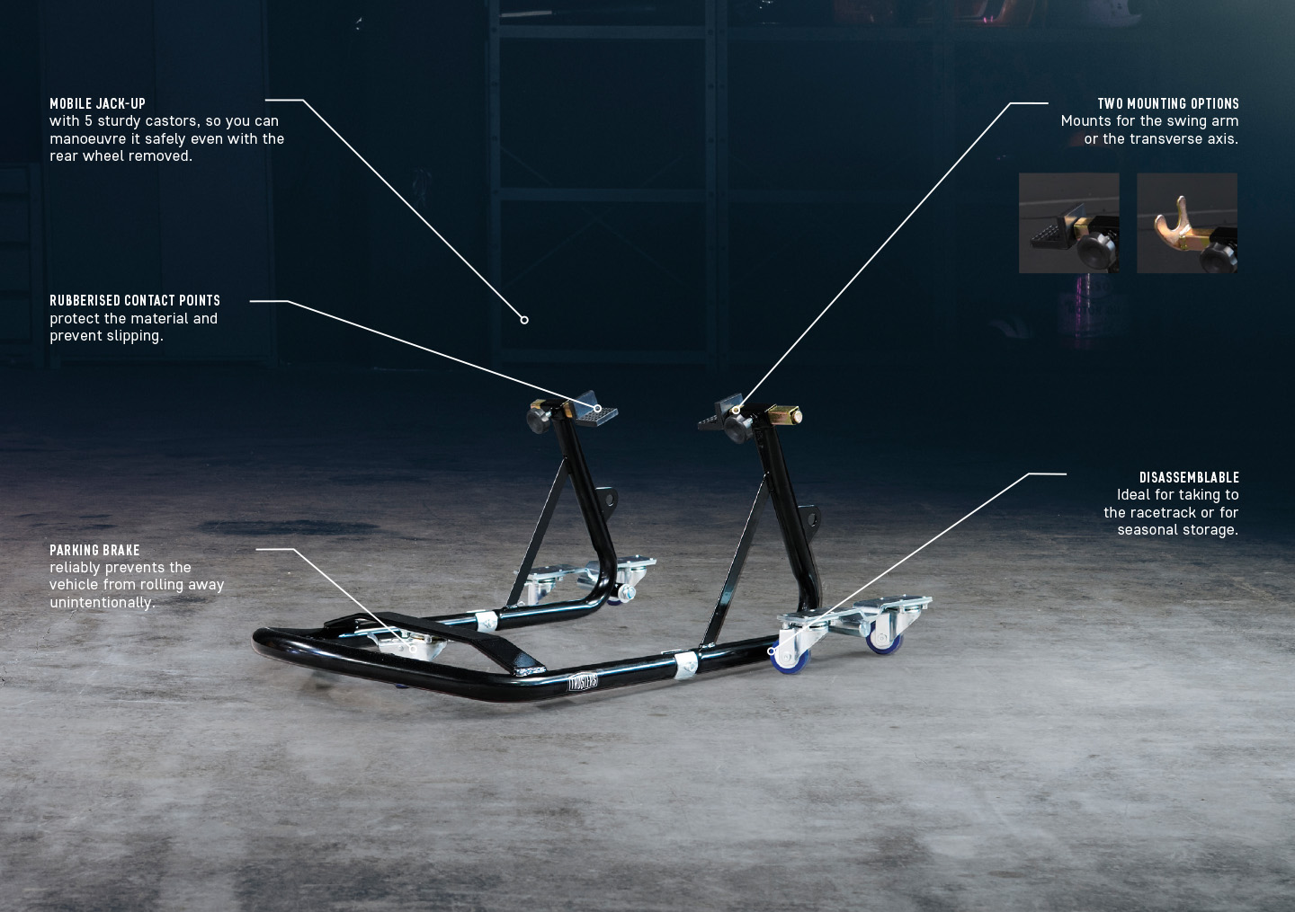 Black motorcycle paddock stand on concrete floor with caster wheels and rubber contact pads; graphic callouts note mobile jack-up, rubberised contact points, two mounting options, parking brake and disassemblable design