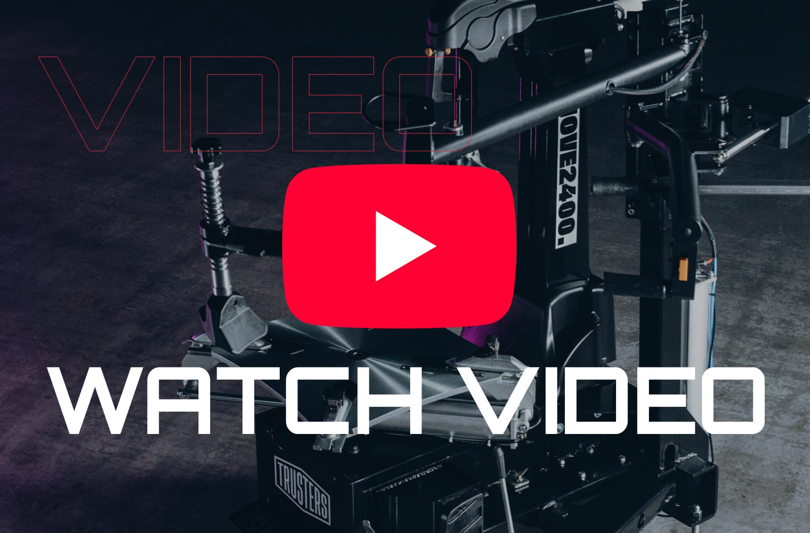 Camera support rig and motion platform in a dark studio, overlaid with a large red YouTube play button icon and bold white text WATCH VIDEO, faint outlined VIDEO text at top left.