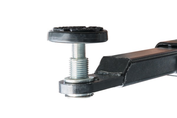 Close-up of an adjustable metal leveling foot with a threaded bolt and black rubber pad mounted on a rectangular black metal furniture leg against a white background