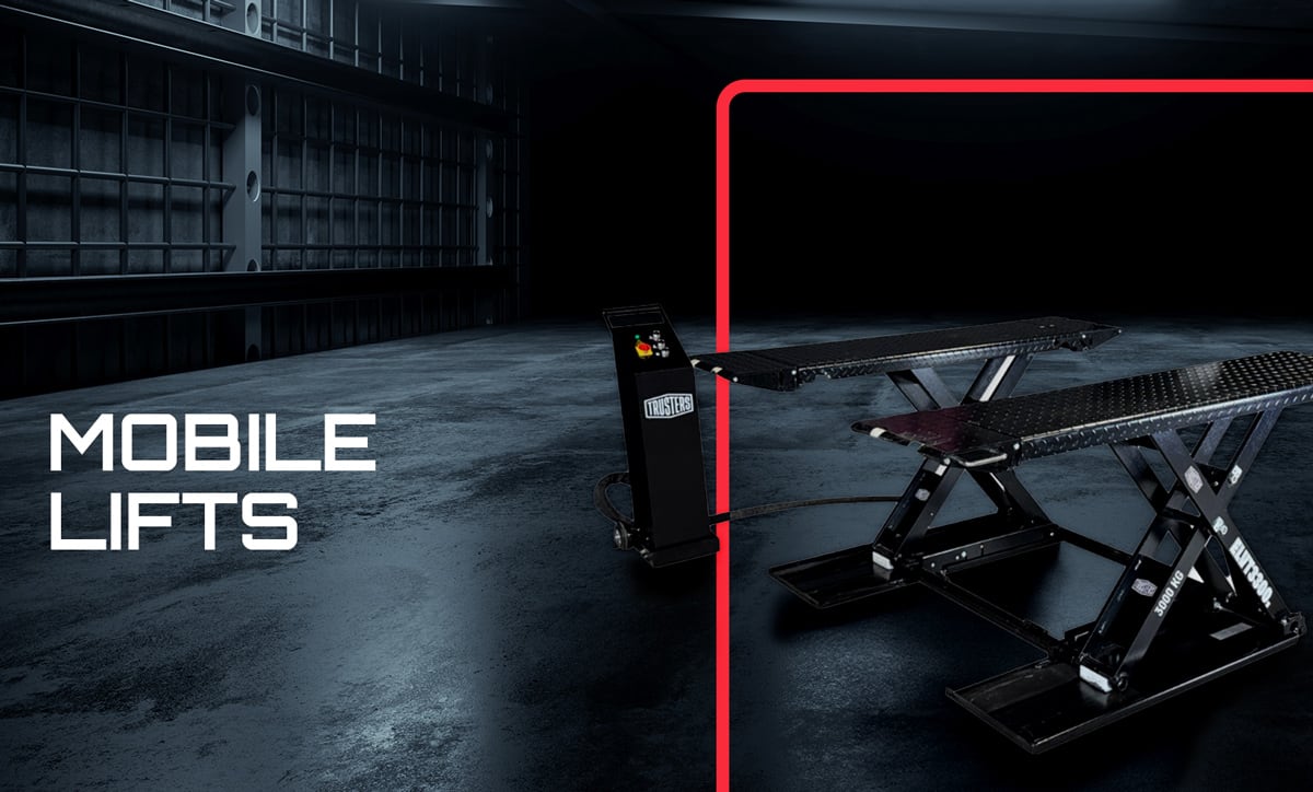 Dim industrial garage floor with two black mobile scissor lifts and a wheeled control unit on the right, red rounded-frame accent, and large white text MOBILE LIFTS on the left