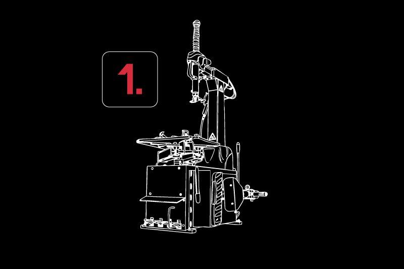 Weiße Konturzeichnung einer Reifenmontiermaschine mit Hebearm und Drehteller auf schwarzem Hintergrund, links oben abgerundetes Quadrat mit roter Ziffer 1