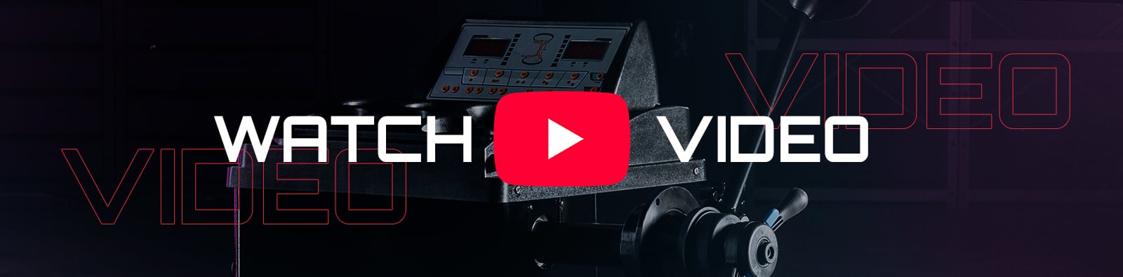 Large red YouTube play icon centered over a dark industrial machine background with white text WATCH on the left and VIDEO on the right, plus faint red outlined VIDEO lettering across the image