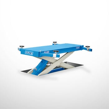 Blue in-ground hydraulic scissor car lift with rectangular flat platform, silver crossed scissor arms, visible hydraulic cylinder and four adjustable round rubber lifting pads on a white background